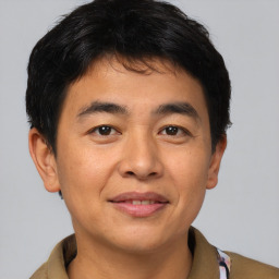 Joyful asian young-adult male with short  brown hair and brown eyes