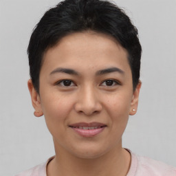 Joyful asian young-adult female with short  brown hair and brown eyes