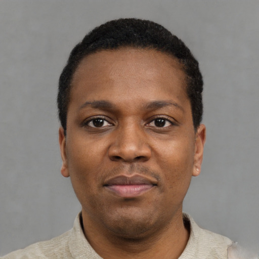 Neutral black young-adult male with short  black hair and brown eyes