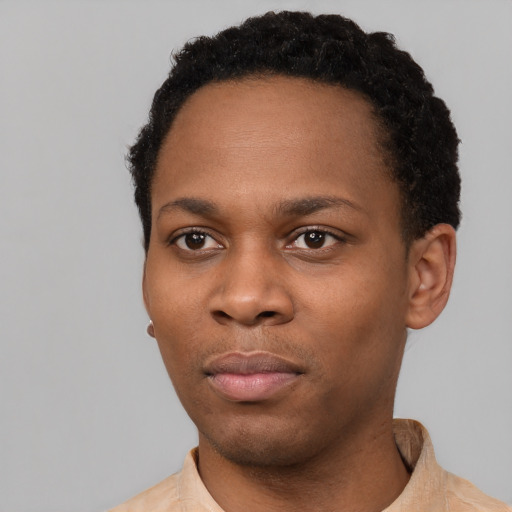 Neutral black young-adult male with short  black hair and brown eyes