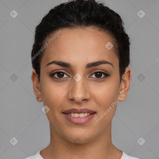 Joyful latino young-adult female with short  black hair and brown eyes