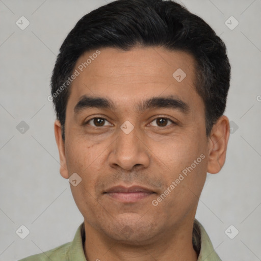 Joyful latino young-adult male with short  black hair and brown eyes