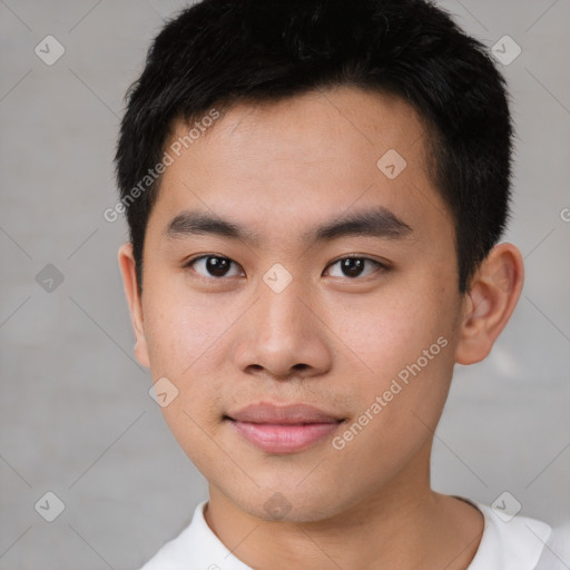 Joyful asian young-adult male with short  brown hair and brown eyes