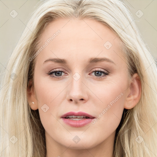 Joyful white young-adult female with long  brown hair and blue eyes