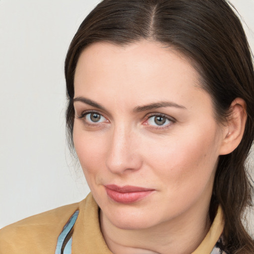 Joyful white young-adult female with medium  brown hair and brown eyes