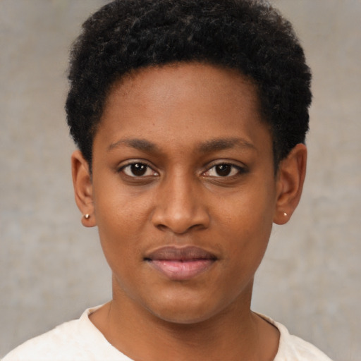 Joyful black young-adult female with short  black hair and brown eyes