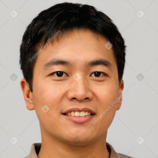 Joyful asian young-adult male with short  brown hair and brown eyes