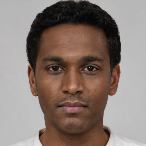 Neutral black young-adult male with short  black hair and brown eyes
