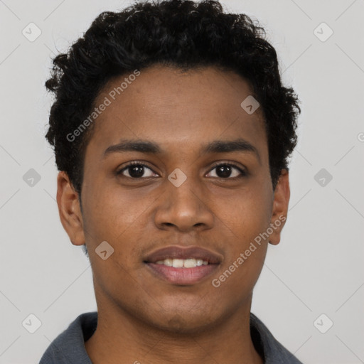 Joyful black young-adult male with short  brown hair and brown eyes