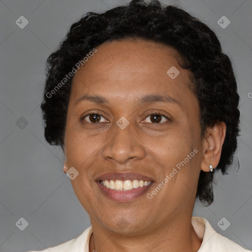 Joyful black adult female with short  brown hair and brown eyes