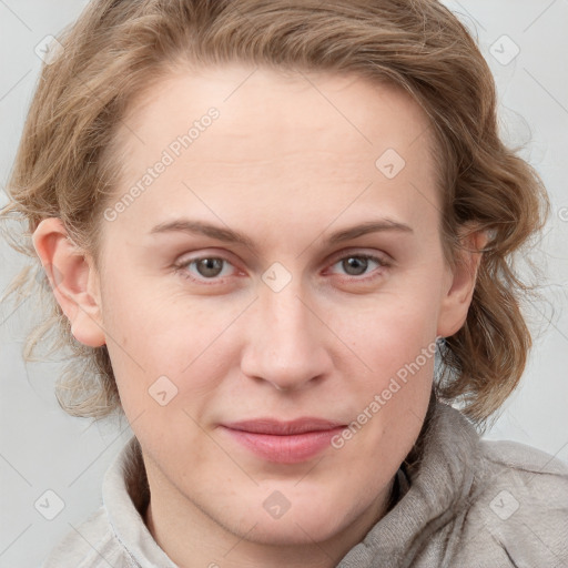 Joyful white young-adult female with medium  brown hair and blue eyes