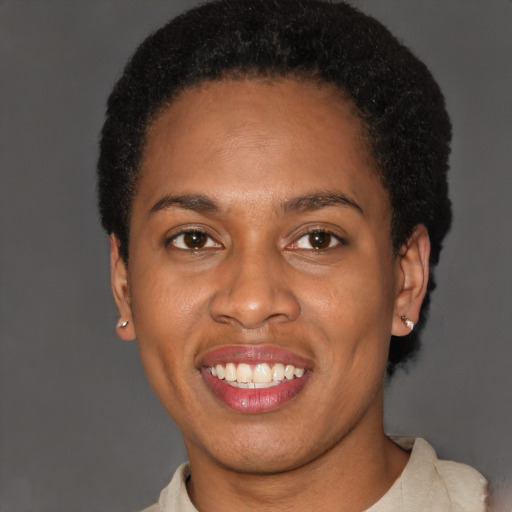 Joyful latino young-adult female with short  black hair and brown eyes