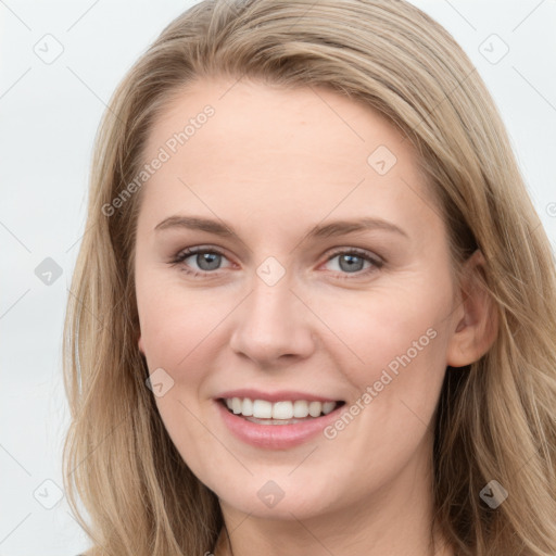 Joyful white young-adult female with long  brown hair and blue eyes