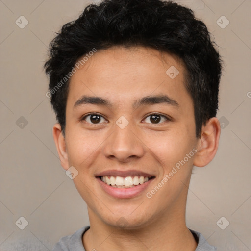 Joyful latino young-adult male with short  brown hair and brown eyes