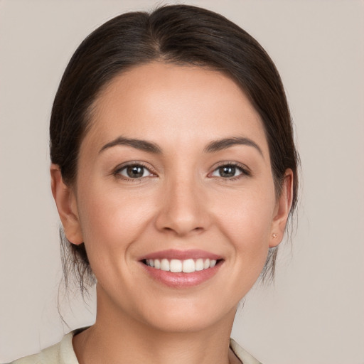 Joyful white young-adult female with medium  brown hair and brown eyes