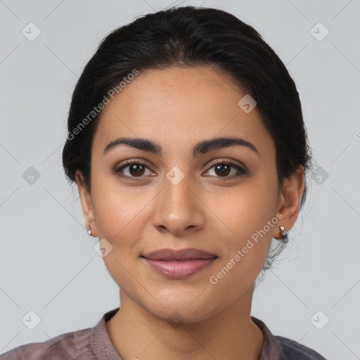 Joyful latino young-adult female with medium  black hair and brown eyes