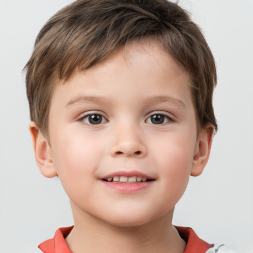 Joyful white child male with short  brown hair and brown eyes