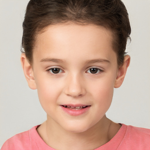 Joyful white child female with short  brown hair and brown eyes