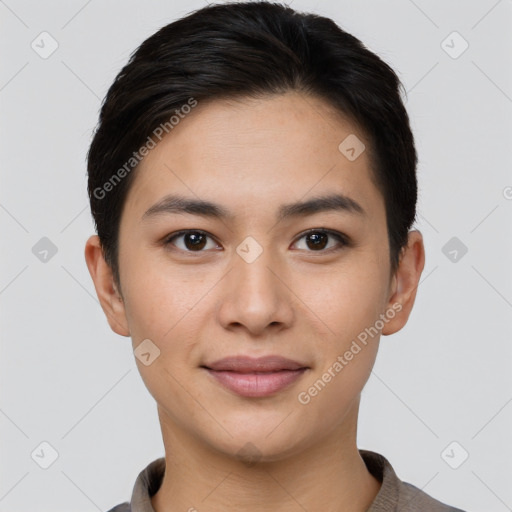 Joyful asian young-adult female with short  brown hair and brown eyes