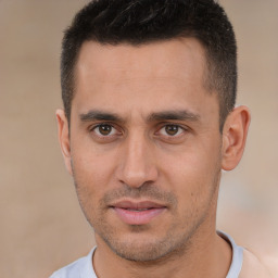 Joyful white young-adult male with short  brown hair and brown eyes