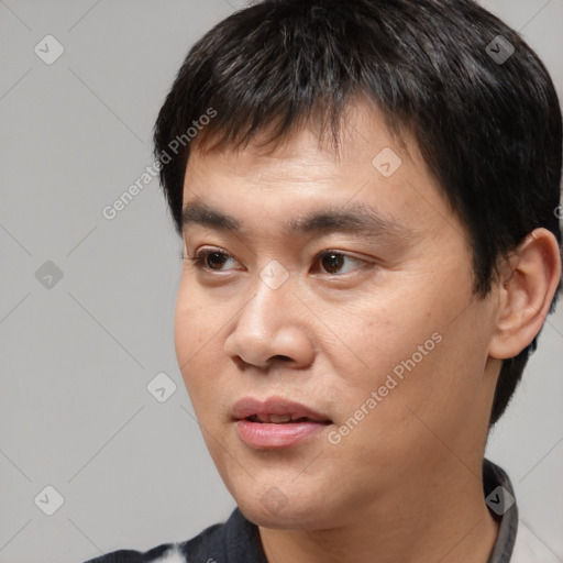 Joyful white young-adult male with short  black hair and brown eyes