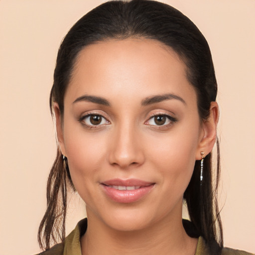 Joyful white young-adult female with long  brown hair and brown eyes