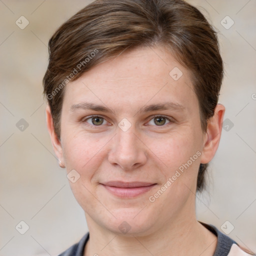 Joyful white adult female with short  brown hair and grey eyes