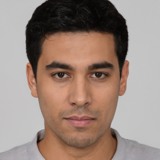 Neutral latino young-adult male with short  black hair and brown eyes
