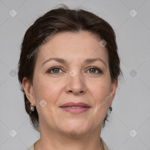 Joyful white adult female with medium  brown hair and grey eyes