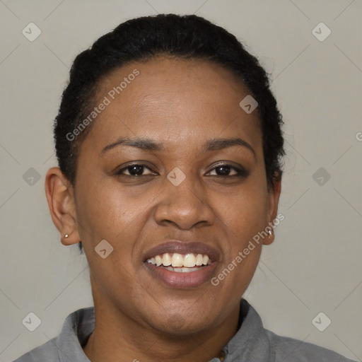 Joyful black adult female with short  black hair and brown eyes