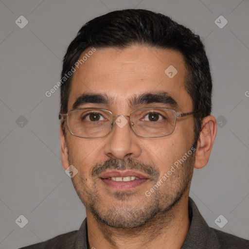 Joyful white adult male with short  black hair and brown eyes