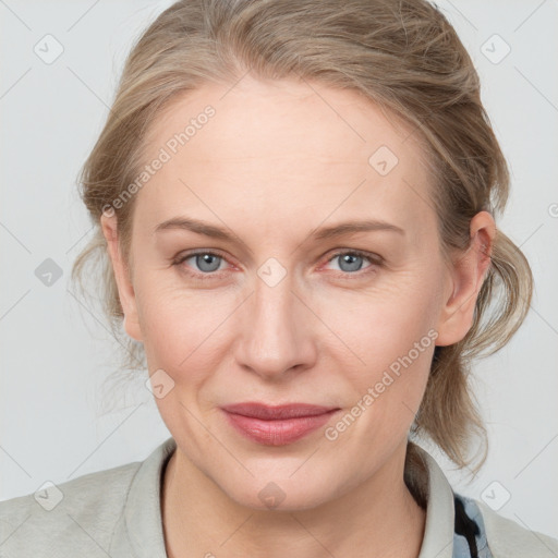 Joyful white young-adult female with medium  brown hair and blue eyes