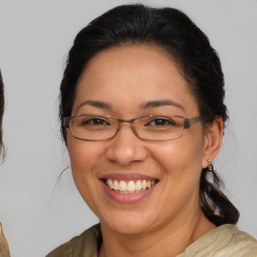 Joyful white adult female with medium  brown hair and brown eyes