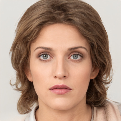 Neutral white young-adult female with medium  brown hair and green eyes