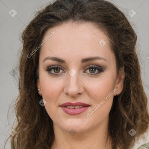 Joyful white young-adult female with long  brown hair and green eyes