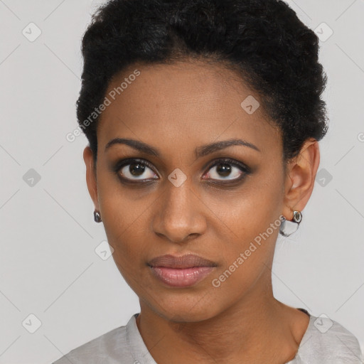 Joyful black young-adult female with short  brown hair and brown eyes