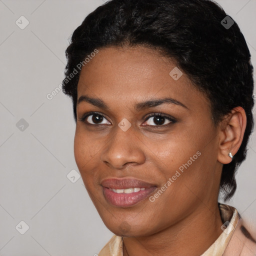 Joyful black young-adult female with short  black hair and brown eyes