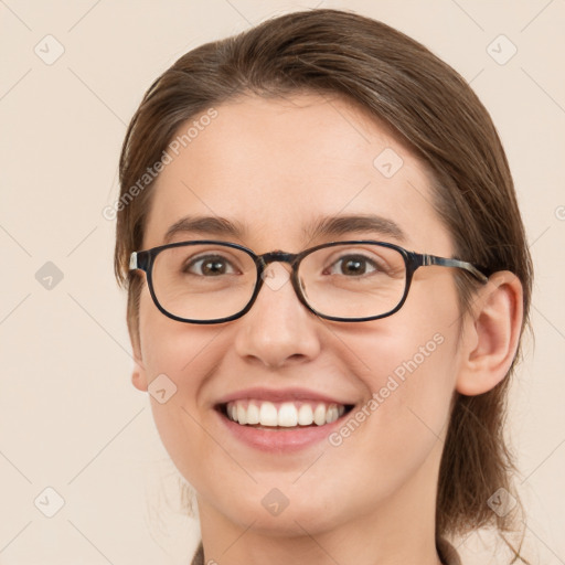 Joyful white young-adult female with medium  brown hair and blue eyes