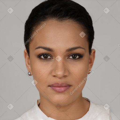 Joyful latino young-adult female with short  black hair and brown eyes