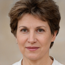 Joyful white adult female with short  brown hair and brown eyes