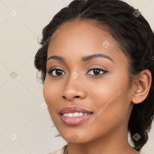 Joyful latino young-adult female with long  brown hair and brown eyes