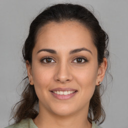 Joyful white young-adult female with medium  brown hair and brown eyes