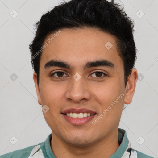 Joyful latino young-adult male with short  brown hair and brown eyes