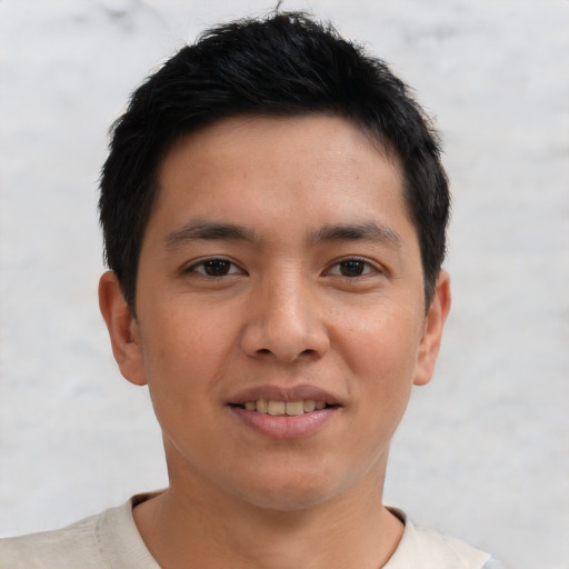 Joyful asian young-adult male with short  brown hair and brown eyes