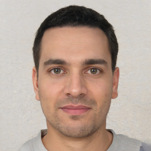 Neutral white young-adult male with short  black hair and brown eyes