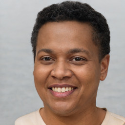 Joyful latino young-adult male with short  brown hair and brown eyes