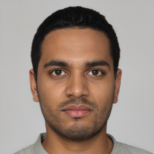 Neutral black young-adult male with short  black hair and brown eyes