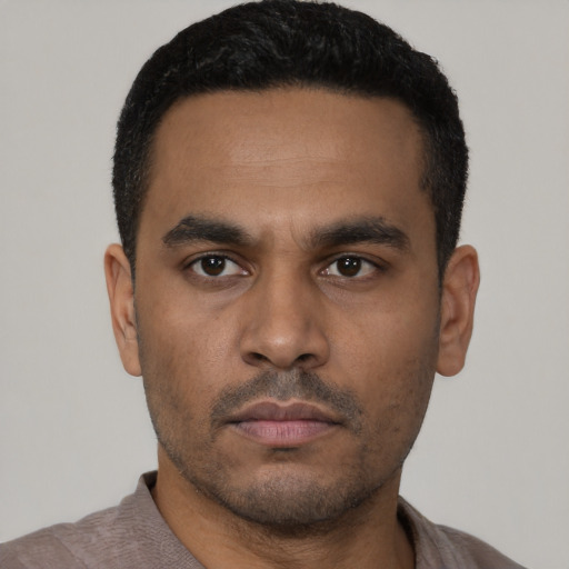 Neutral latino young-adult male with short  black hair and brown eyes