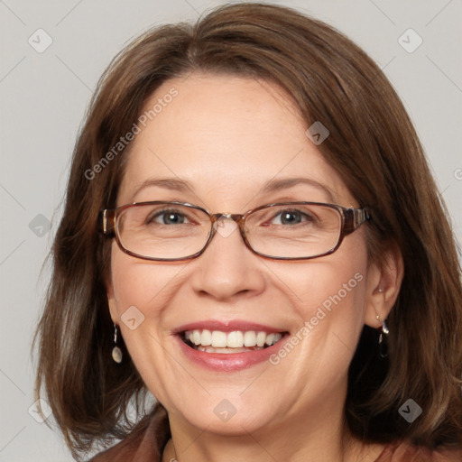 Joyful white adult female with medium  brown hair and blue eyes