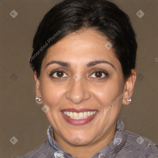 Joyful white adult female with short  brown hair and brown eyes